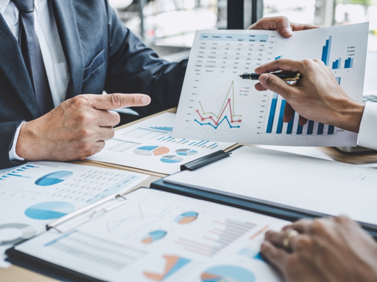 Two executive discussing company growth project success financial statistics, Partner meeting professional investor working start up project for both company with document, laptop and digital tablet.