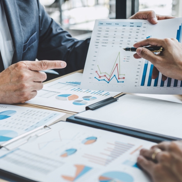 Two executive discussing company growth project success financial statistics, Partner meeting professional investor working start up project for both company with document, laptop and digital tablet.